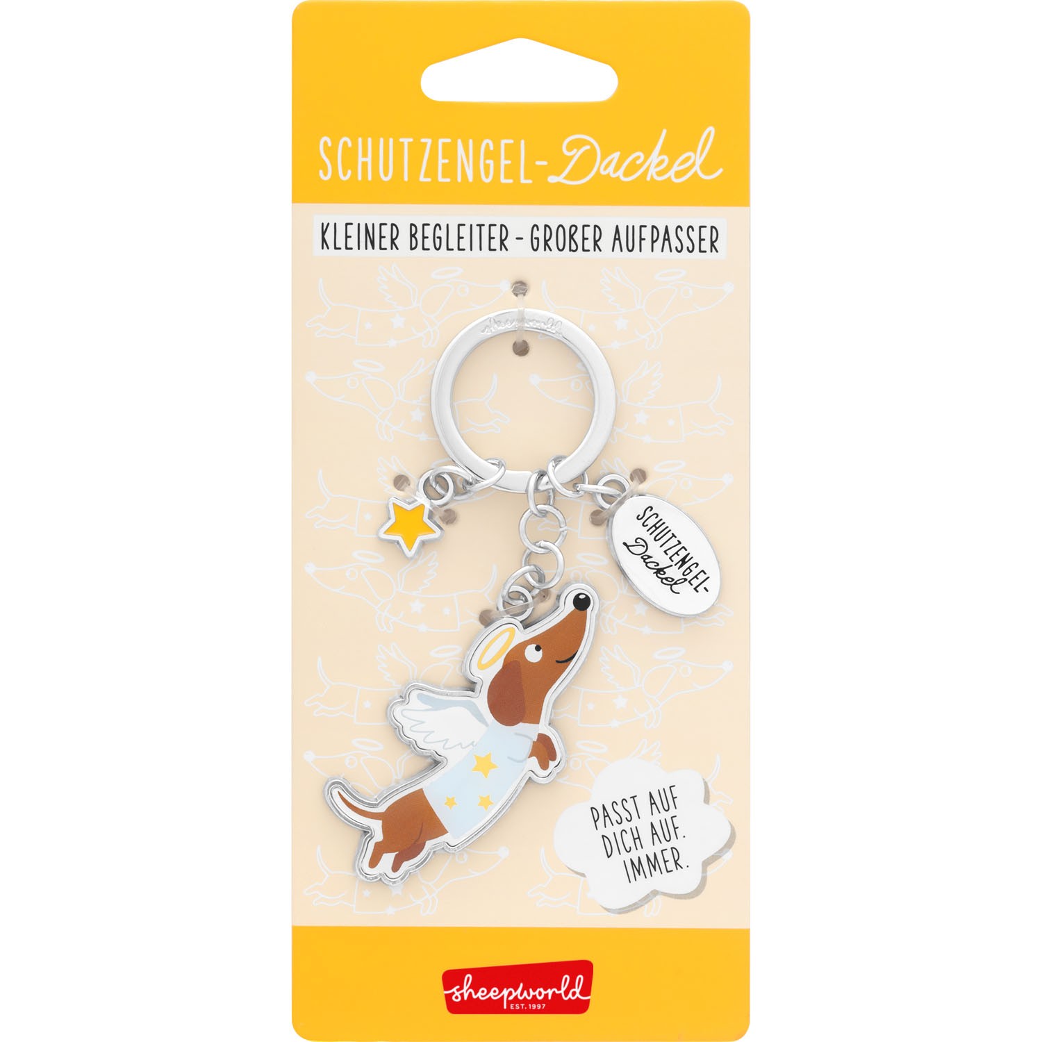 Schutzengel-Dackel Schlüsselanhänger mit Stern-Anhänger vor pastellgelber Sheepworld-Verpackung