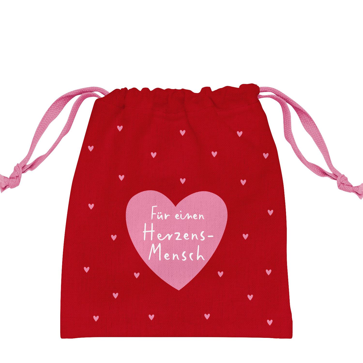 Rotes Stoff-Geschenksäckchen mit pinkem Kordelzug und großem rosa Herzmotiv