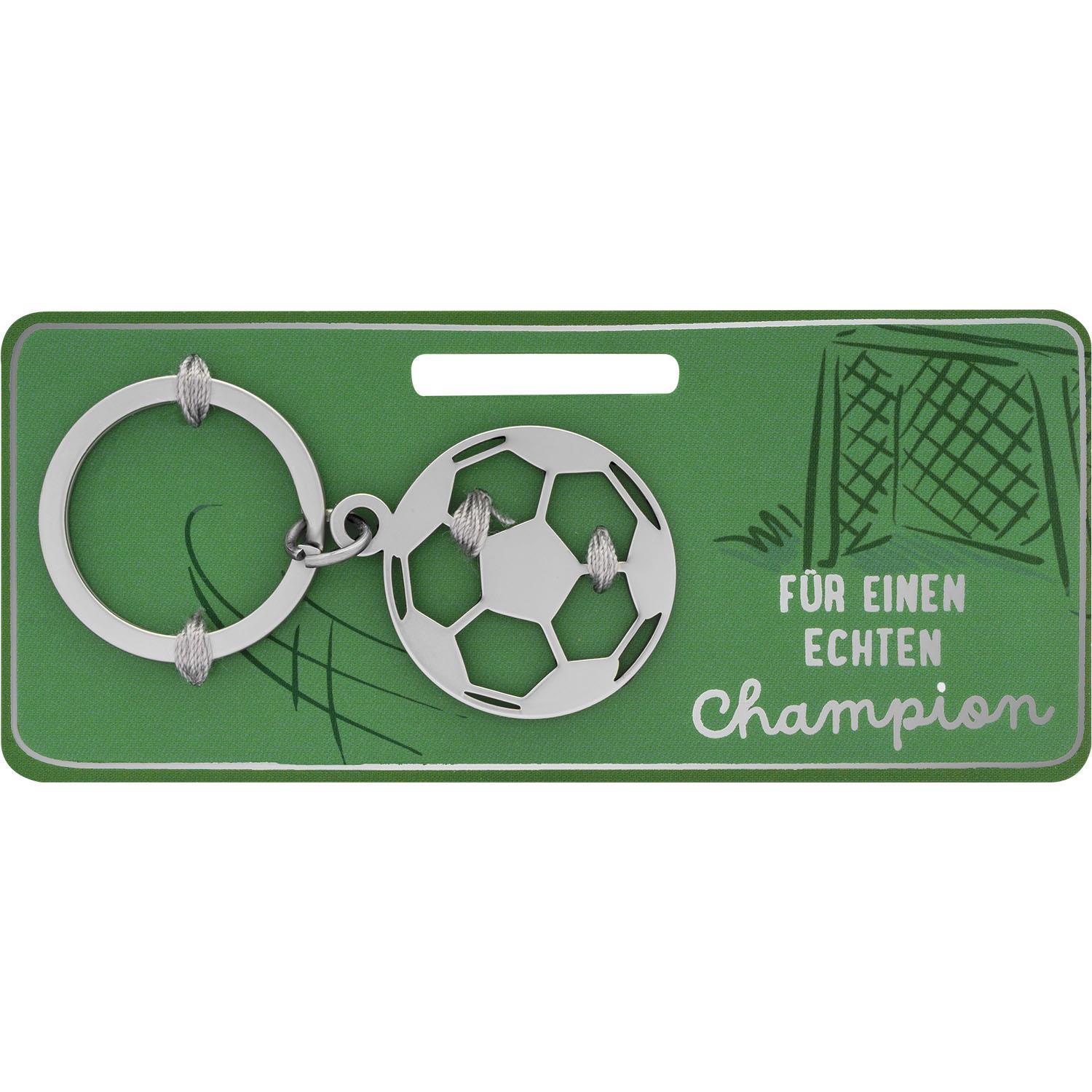 Silberner Fußball-Schlüsselanhänger mit zwei Ringen auf grünem Verpackungskärtchen.