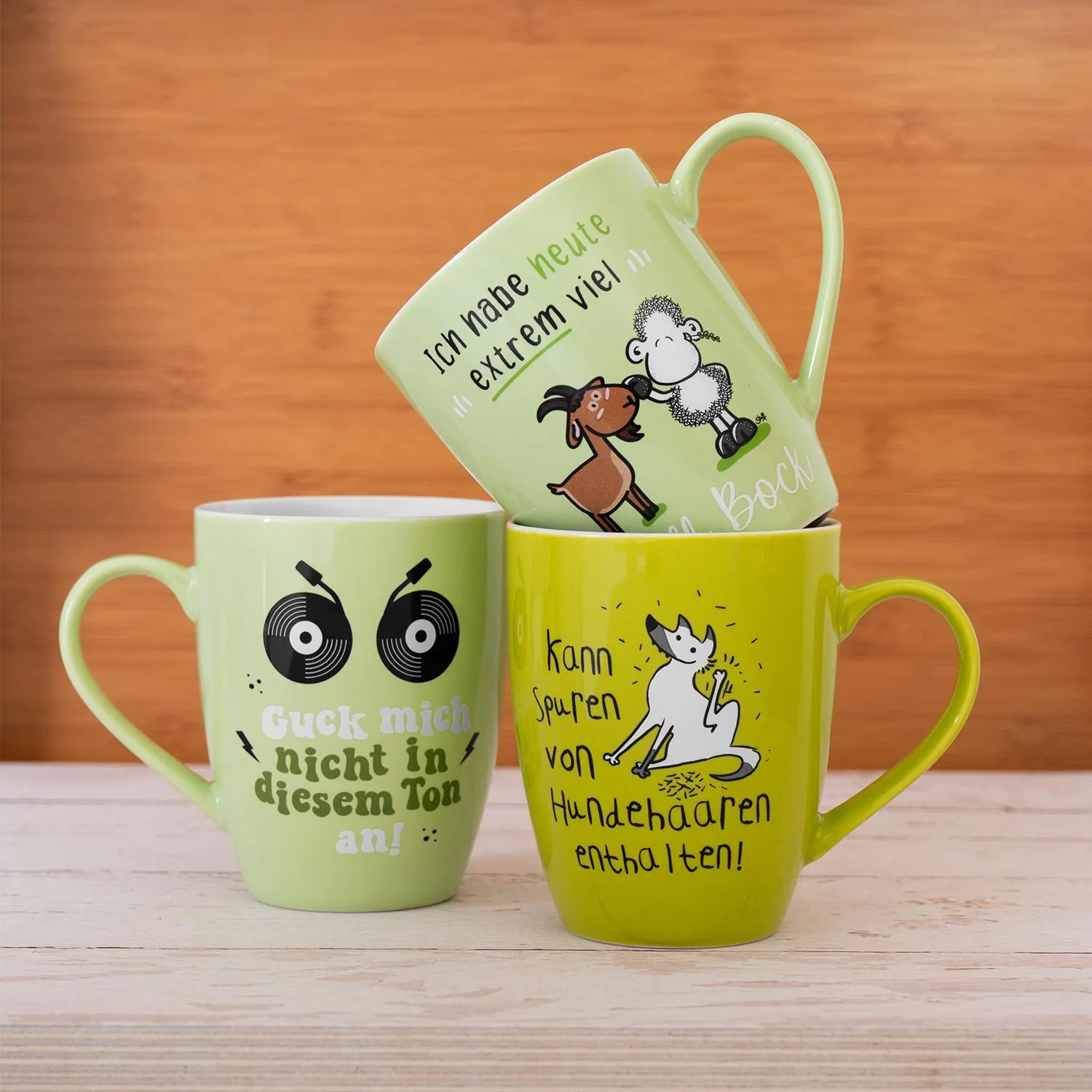 Dreier-Set pastellgrüner Becher mit Schäfchen-Motiven und witzigen Sprüchen aus Porzellan.