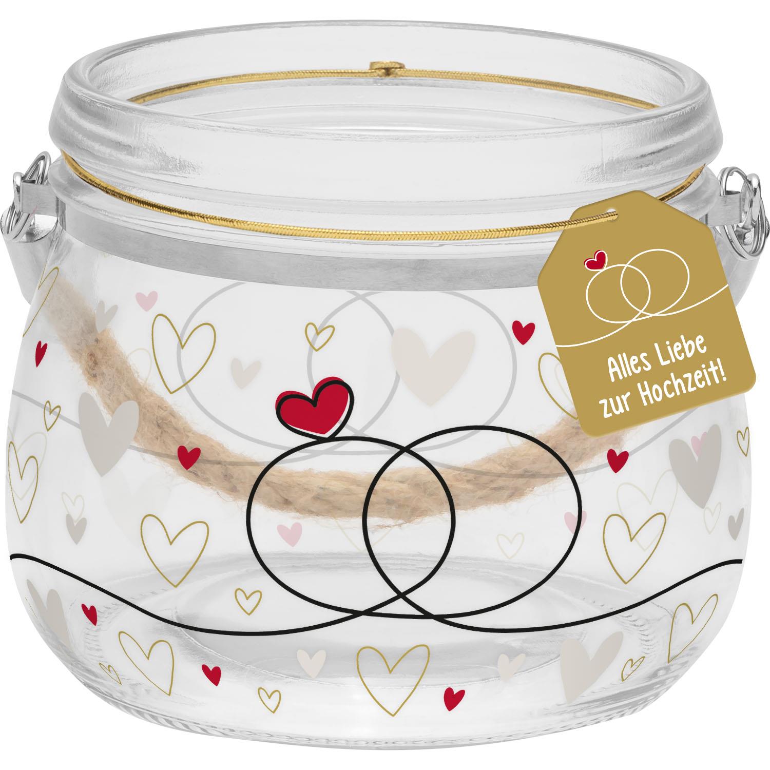 Windlicht aus Glas mit Ringen- und Herzmotiv, Goldakzenten und Natur-Tragegriff.