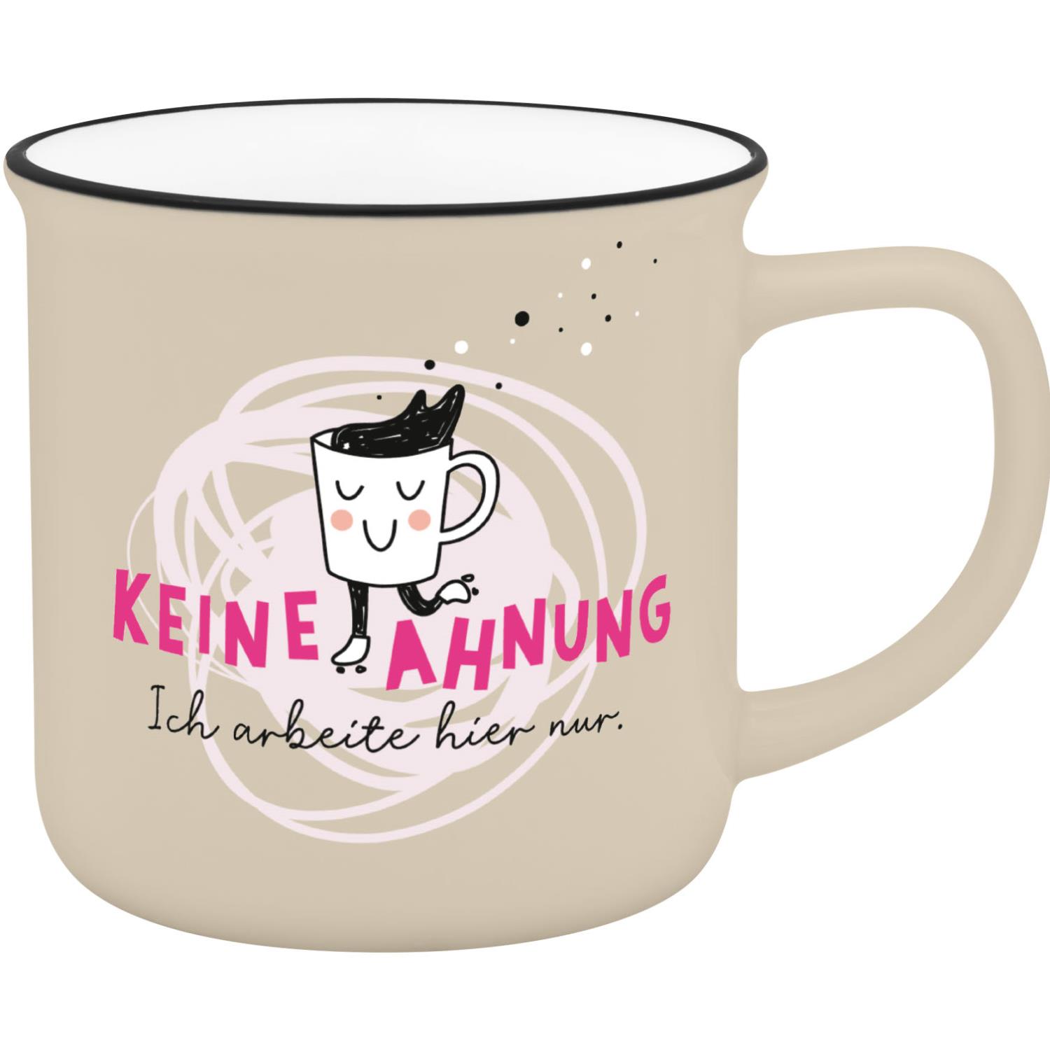 Beige Keramik-Becher mit Cartoon-Gesicht und pinkem Text 'KEINE AHNUNG'