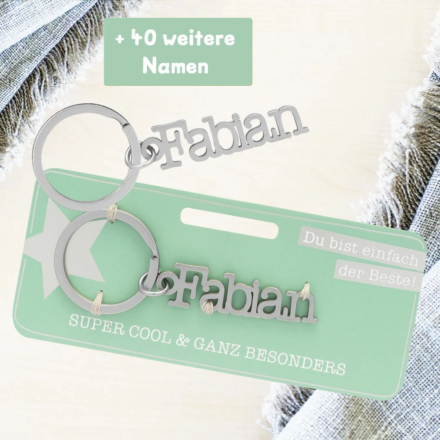 Namens-Schlüsselanhänger aus Edelstahl mit dem silbernen Schriftzug Fabian und Schlüsselring