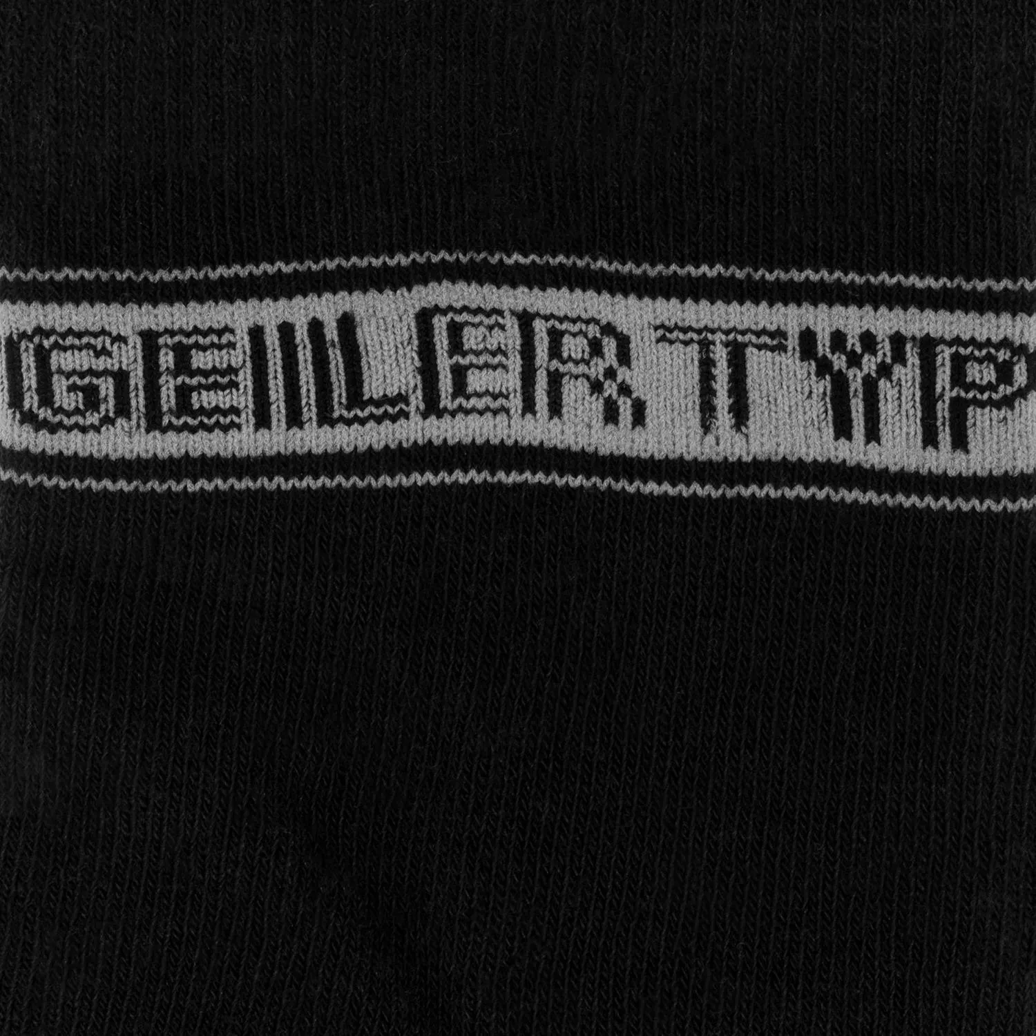 Schwarze Bio-Baumwollsocken mit weißem Schriftzug Geiler Typ