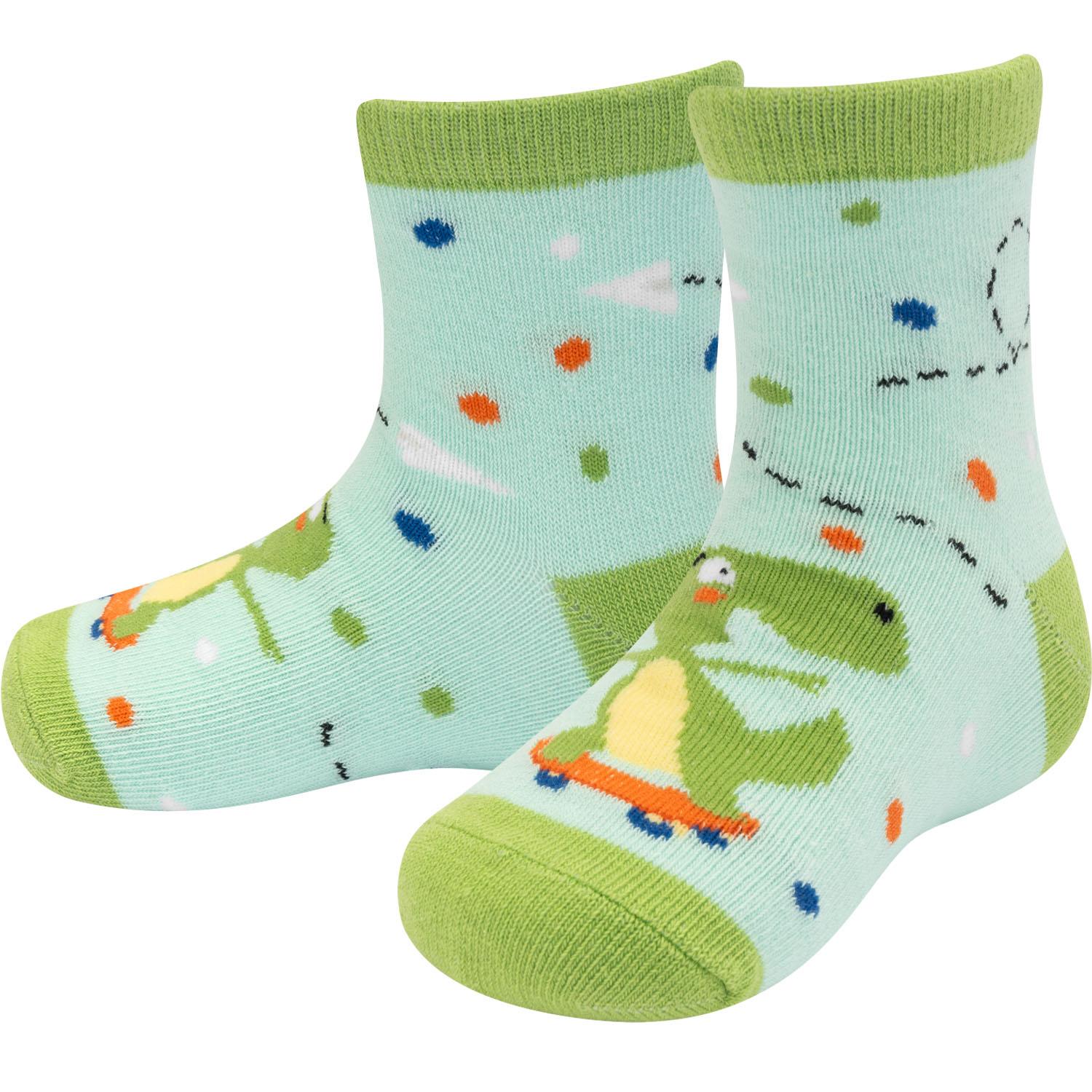Kleinkind-Socken mit Dinosaurier-Motiv auf mintgrünem Hintergrund und bunten Punkten.