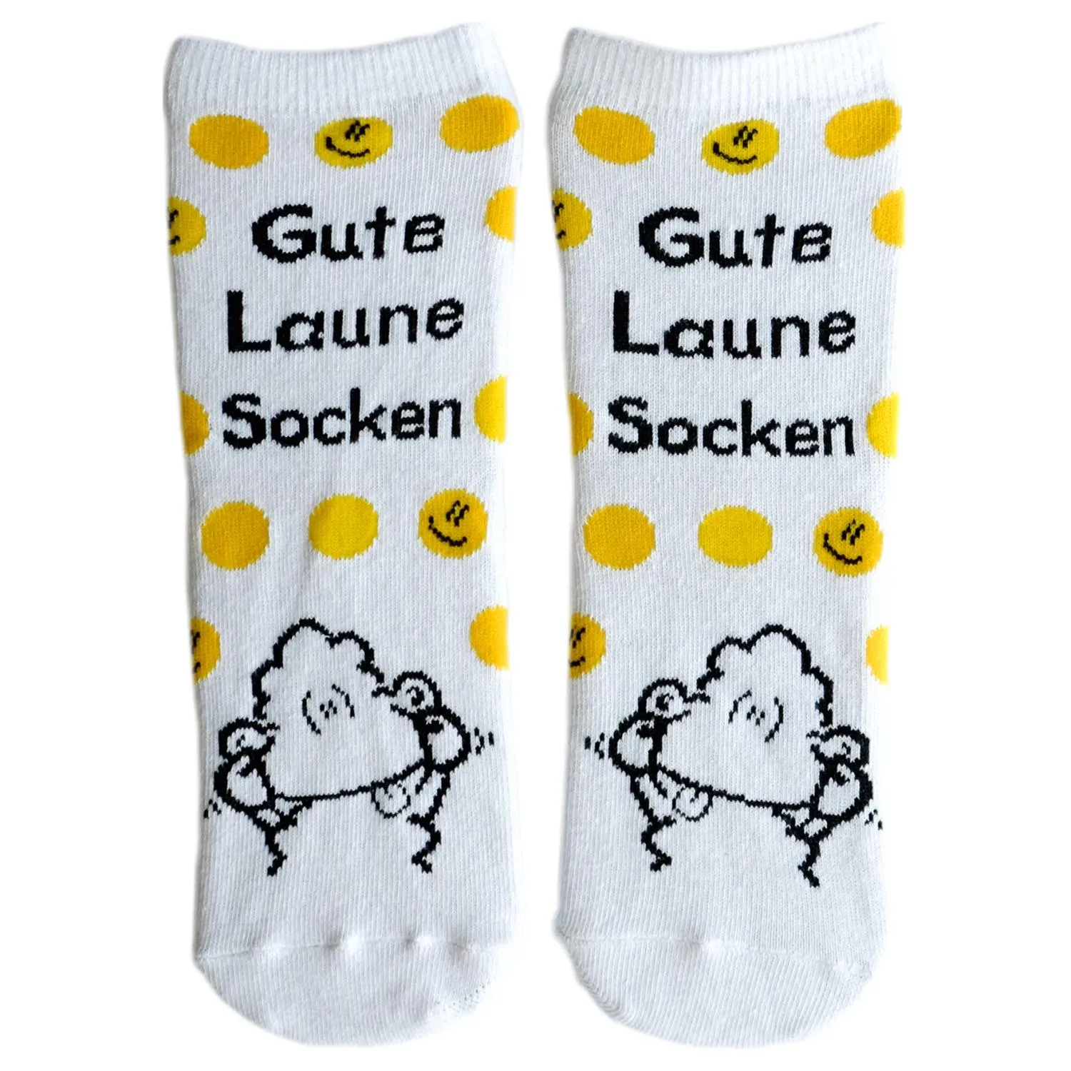 Paar weiße Socken mit gelben Punkten und Schäfchen-Motiv