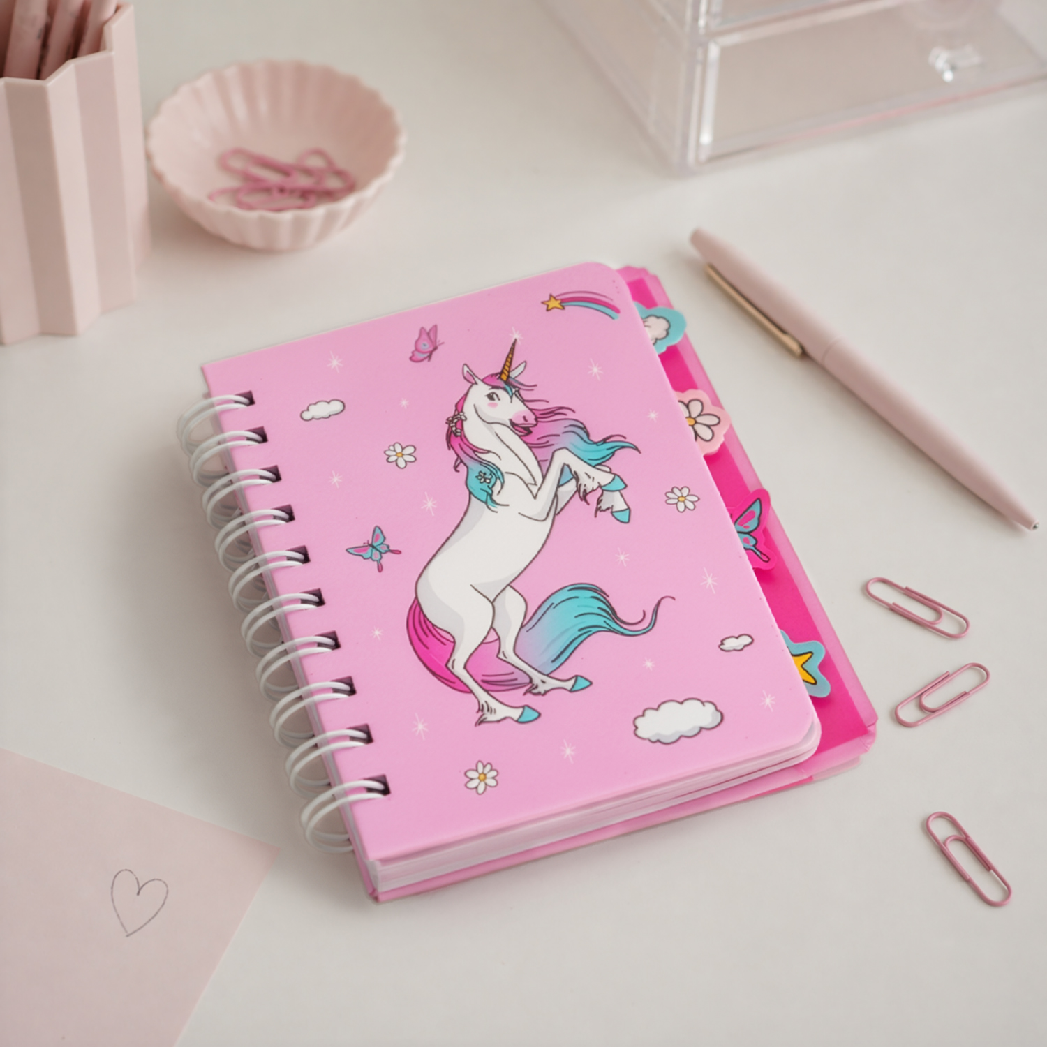 Pinkes Einhorn-Notizbuch mit Spiralbindung und buntem Motiv