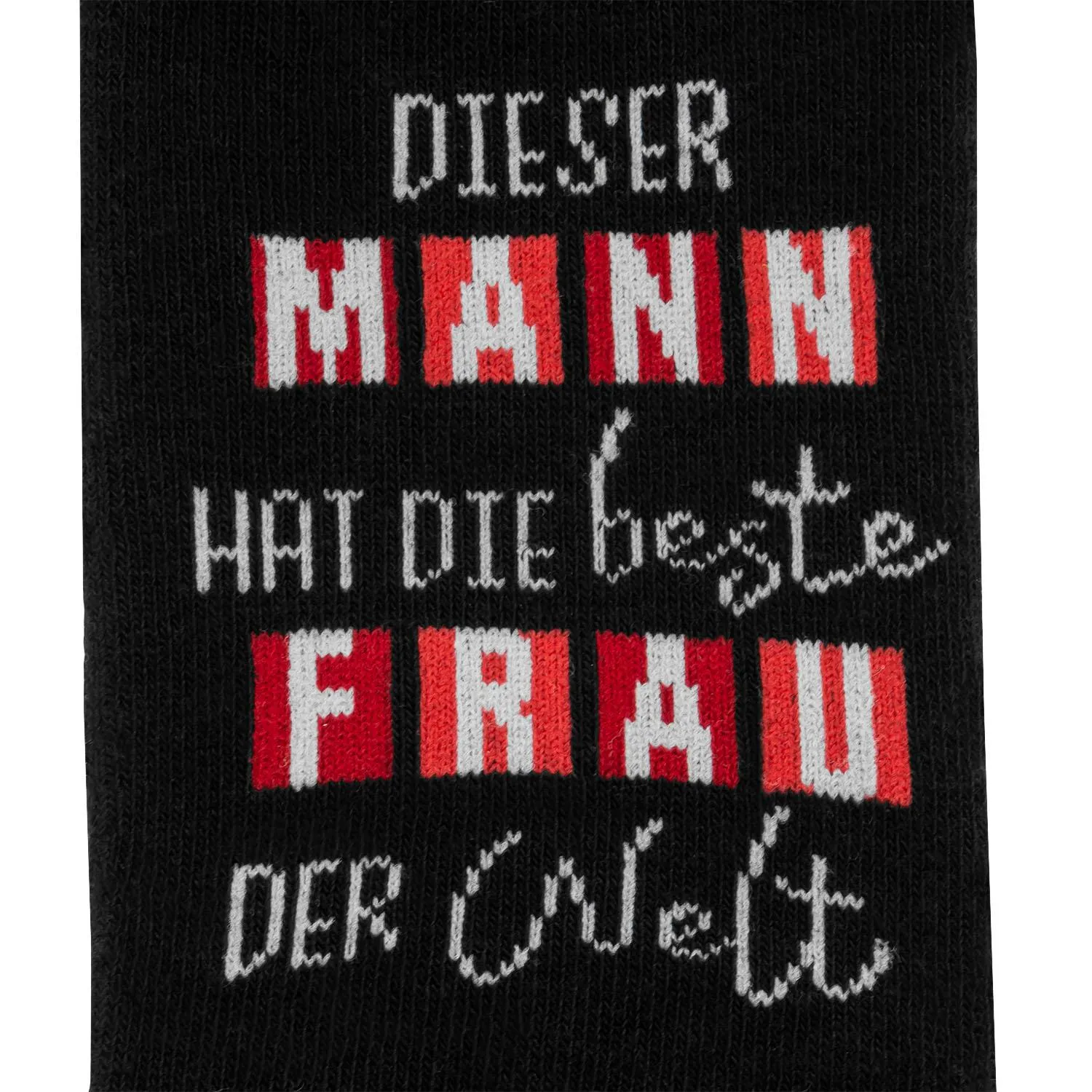 Schwarze Zaubersocke mit rotem und weißem Schriftzug: 'DIESER MANN HAT DIE BESTE FRAU DER WELT'