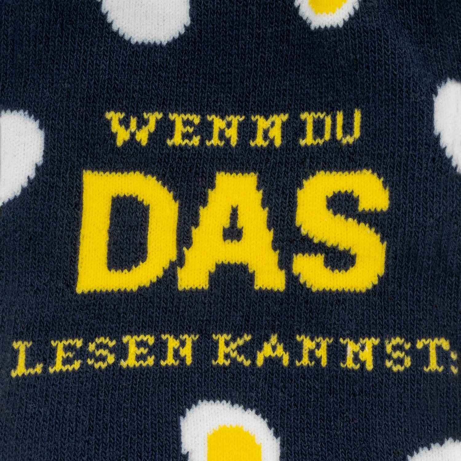 Dunkelblaue Socke mit gelbem DAS-Logo und weißen Punkten