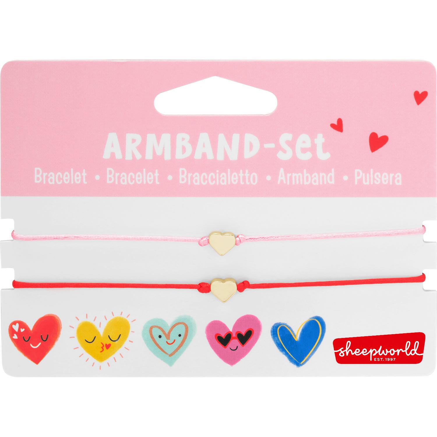 Zwei Armband-Schnüre in Rosa und Rot mit goldfarbenem Herzanhänger – ideales Geschenkset für die beste Freundin.