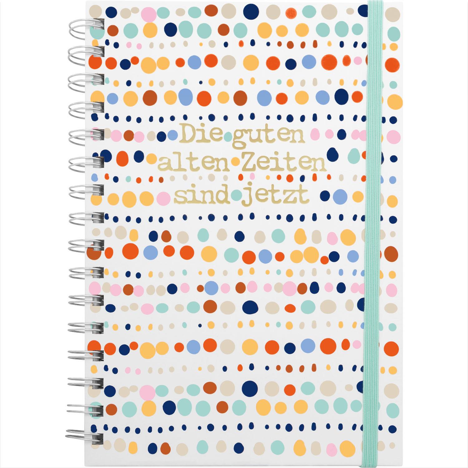 Notizbuch mit buntem Punkte-Design, Spiralbindung und Mint-Gummiband.