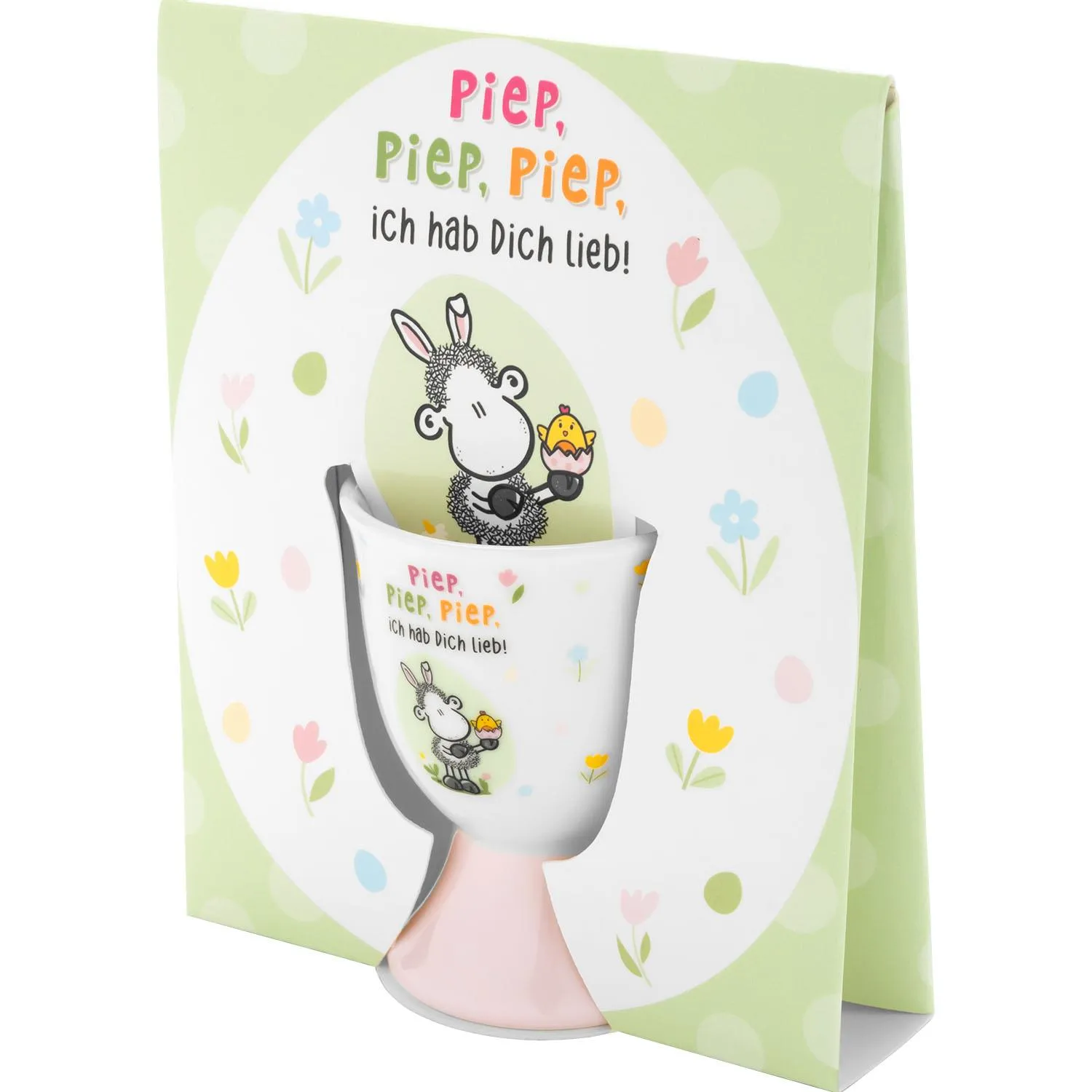Weißer Eierbecher mit süßem Schafmotiv und pastellfarbener Osterdekoration.