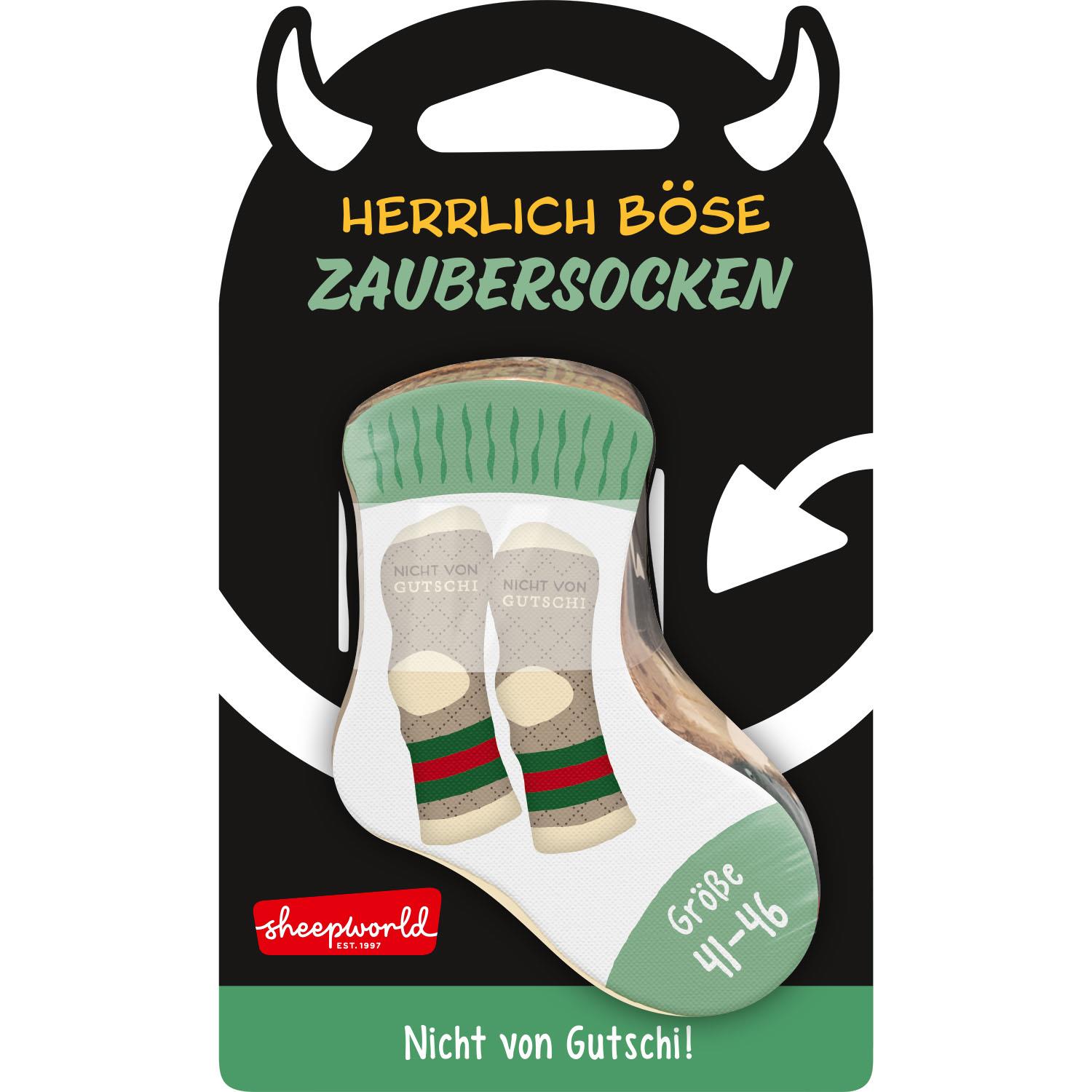 Weiße/beigefarbene Zaubersocken »Gutschi« in Sheepworld-Verpackung mit 'Nicht von Gutschi!'-Motiv.