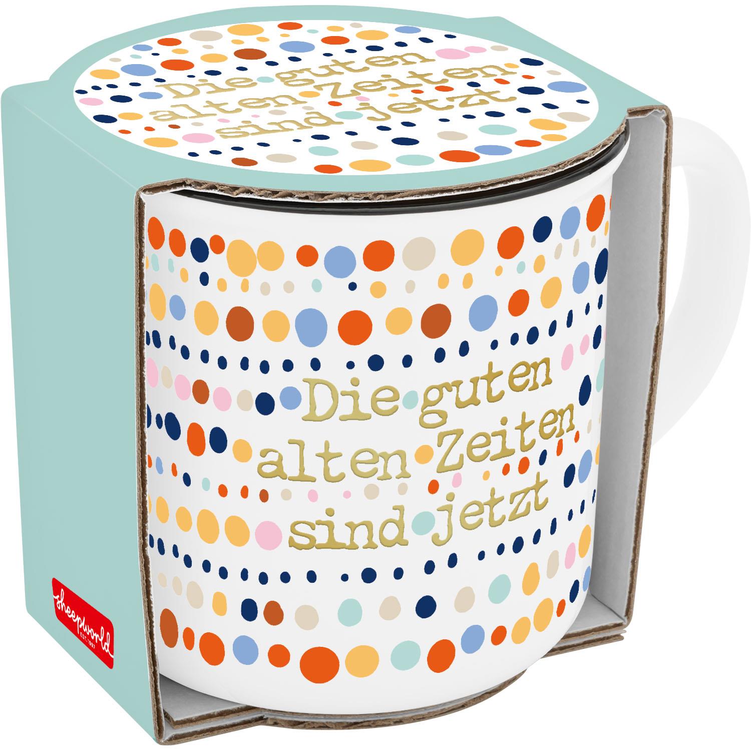 Becher mit bunten Punkten und goldener Schrift 'Die guten alten Zeiten sind jetzt'