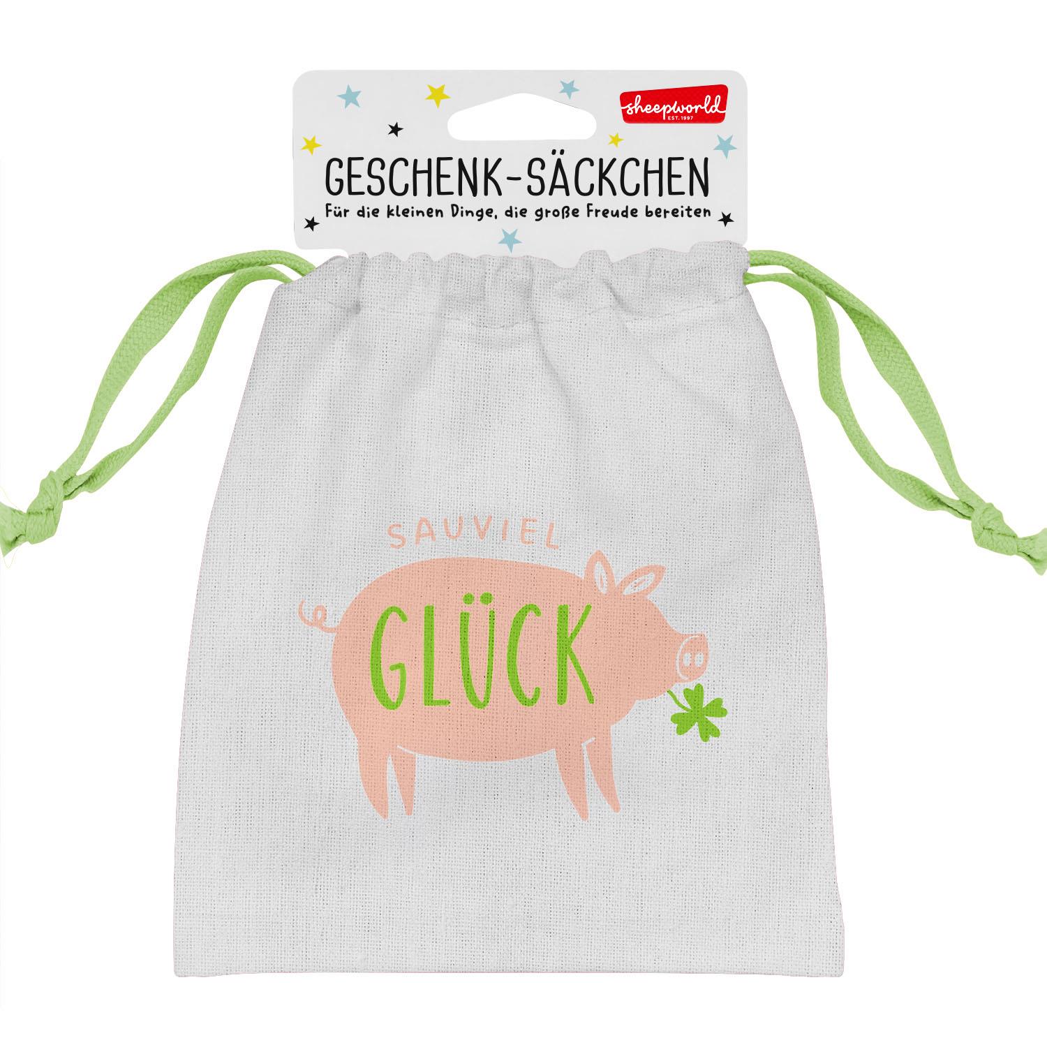 Weißes Geschenk-Säckchen mit Glücksschwein-Motiv in Pfirsich-Pink und grünem GLÜCK-Schriftzug.