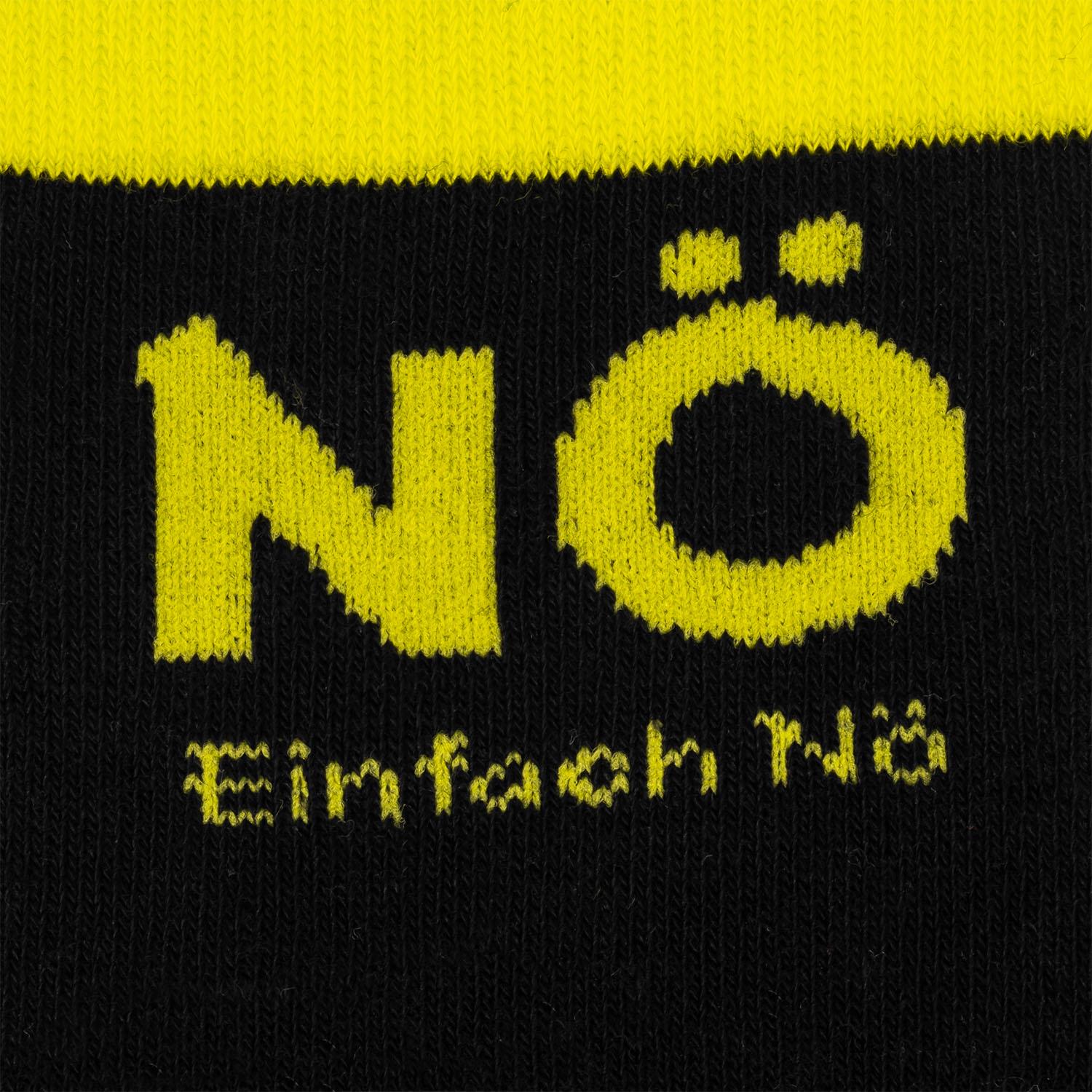 Schwarze Socke mit gelbem 'Nö'-Aufdruck, Headercard mit Teufelshörnern
