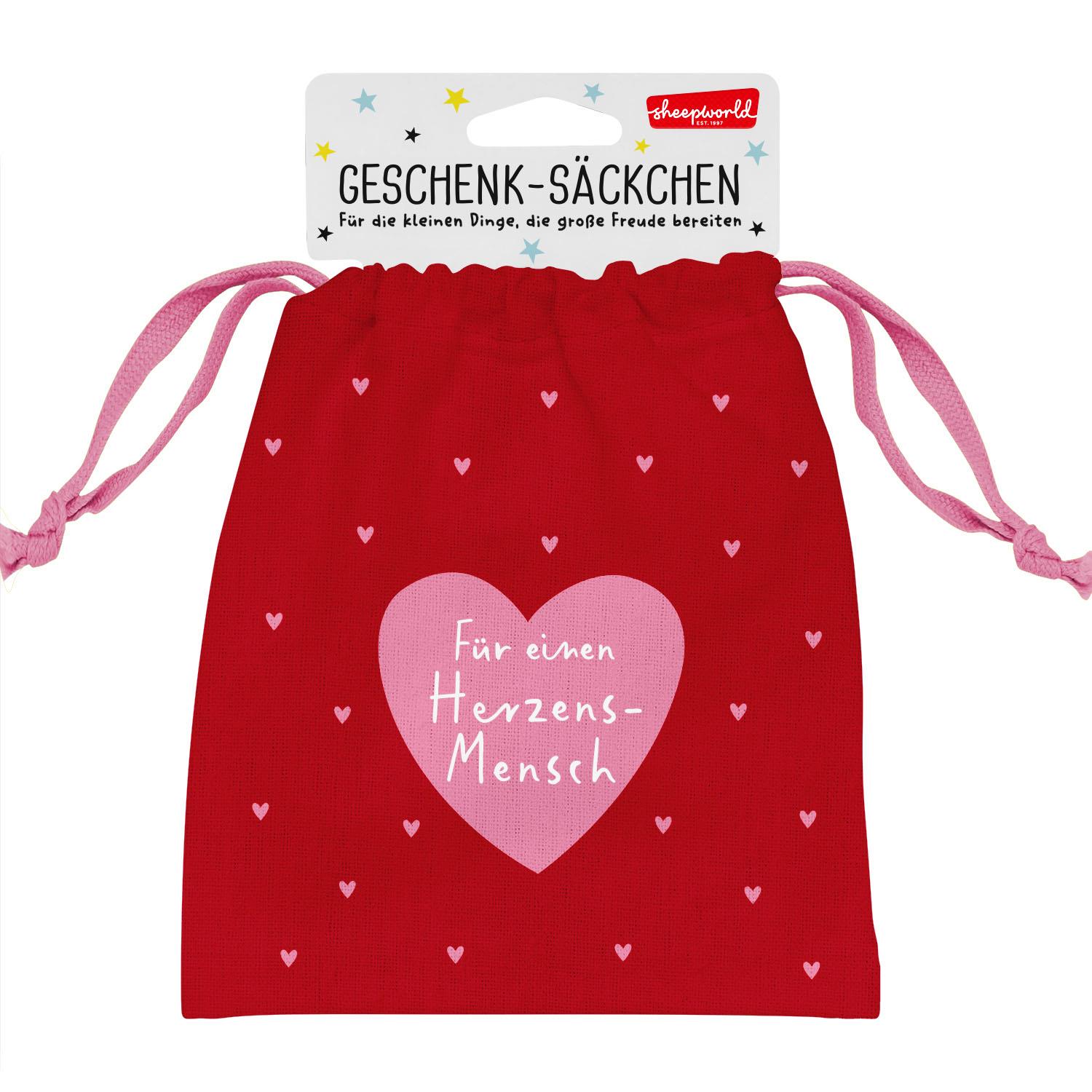 Rotes Geschenksäckchen mit rosa Herzen und rosa Zugbändern