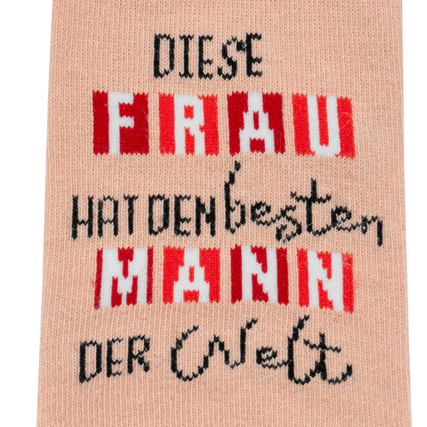 Pastellpinkfarbene Socke mit schwarzem Spruch 'Diese Frau hat den besten Mann der Welt'