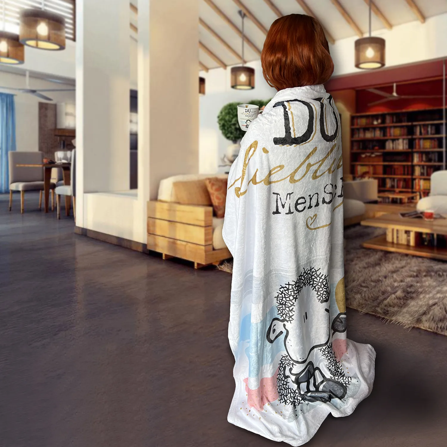 Weiße Fleece-Decke mit Schäfchen-Motiv und Goldschrift 'Du bist mein Lieblingsmensch'.