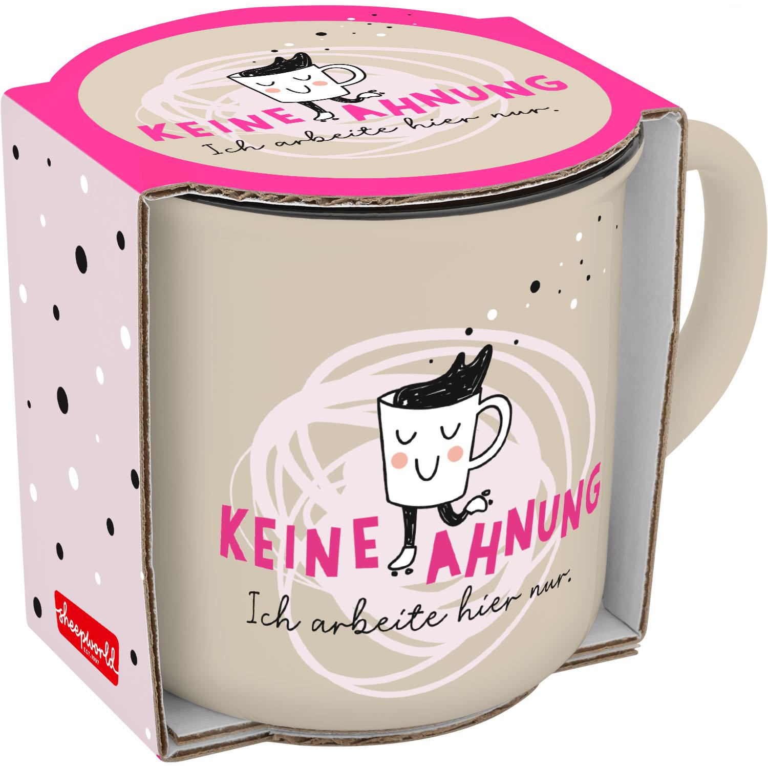 Becher mit lachendem Gesichts-Motiv und dem Spruch KEINE AHNUNG; Verpackung in Pink.
