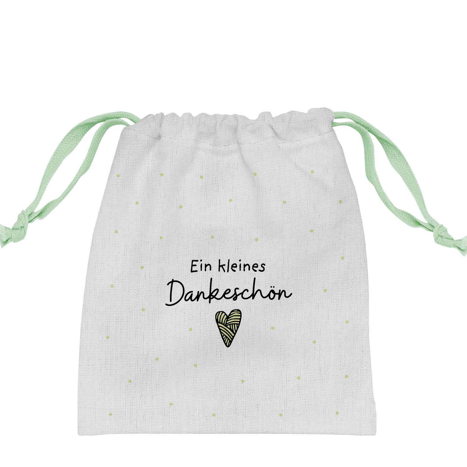 Weißes Canvas-Geschenksäckchen mit mintgrünen Zugbändern und Druck 'Ein kleines Dankeschön' mit Herz