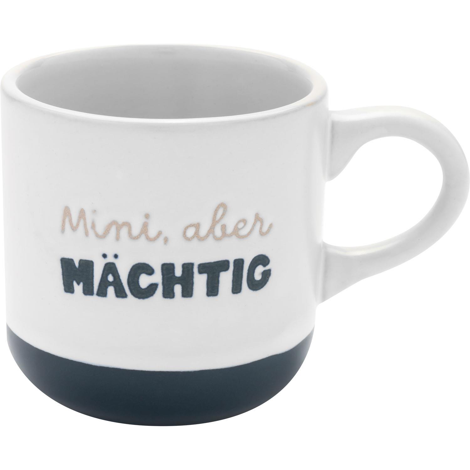 Weiße Espressotasse mit dunkelblauem Boden und dem Spruch 'Mini, aber Mächtig'