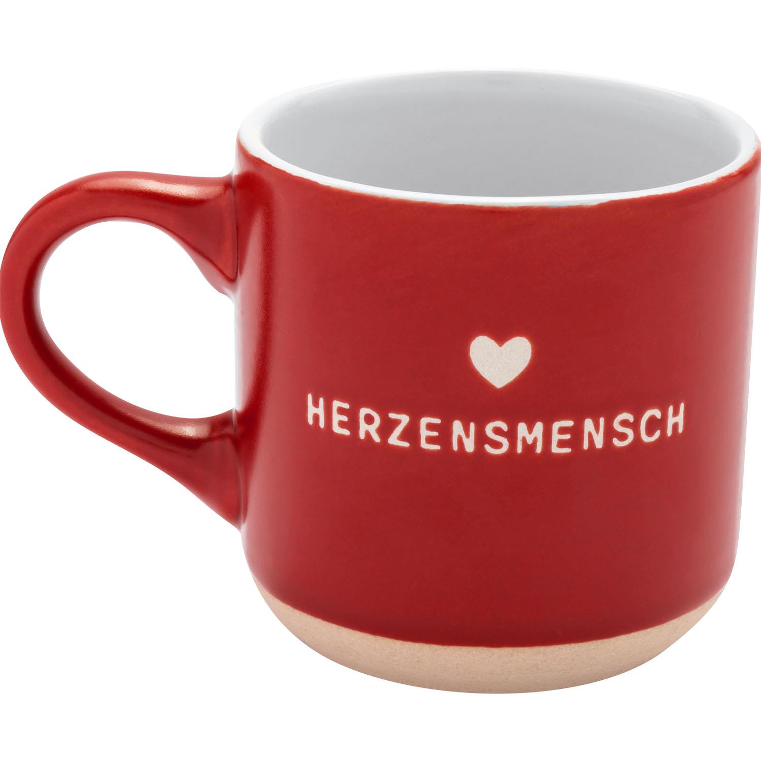 Rote Espressotasse aus Steinzeug mit weißem Innenraum, Herzmotiv und Schriftzug Herzensmensch.