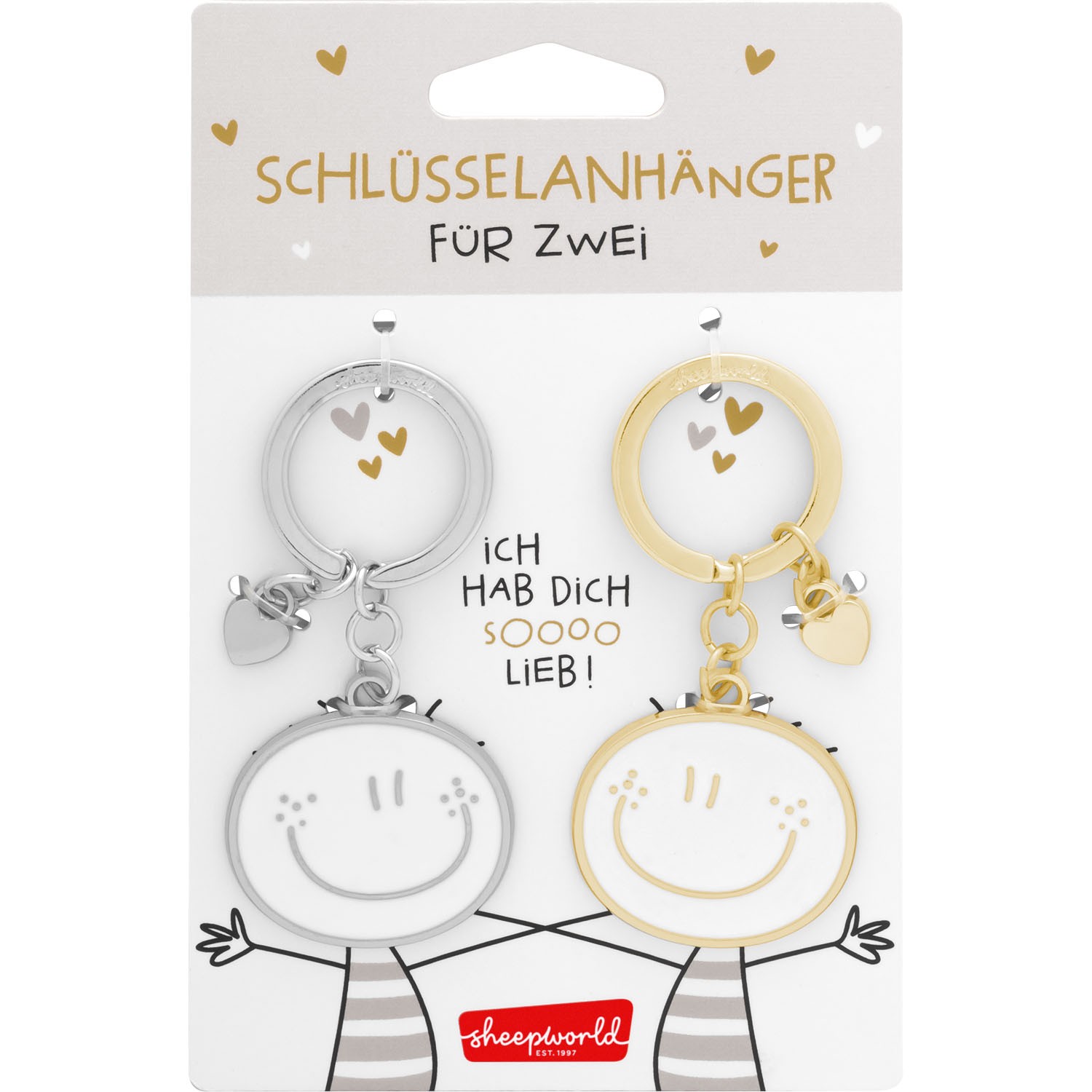 Zwei runde Schlüsselanhänger aus Metall, Silber und Gold, mit Smileys und kleinem Herz-Anhänger.
