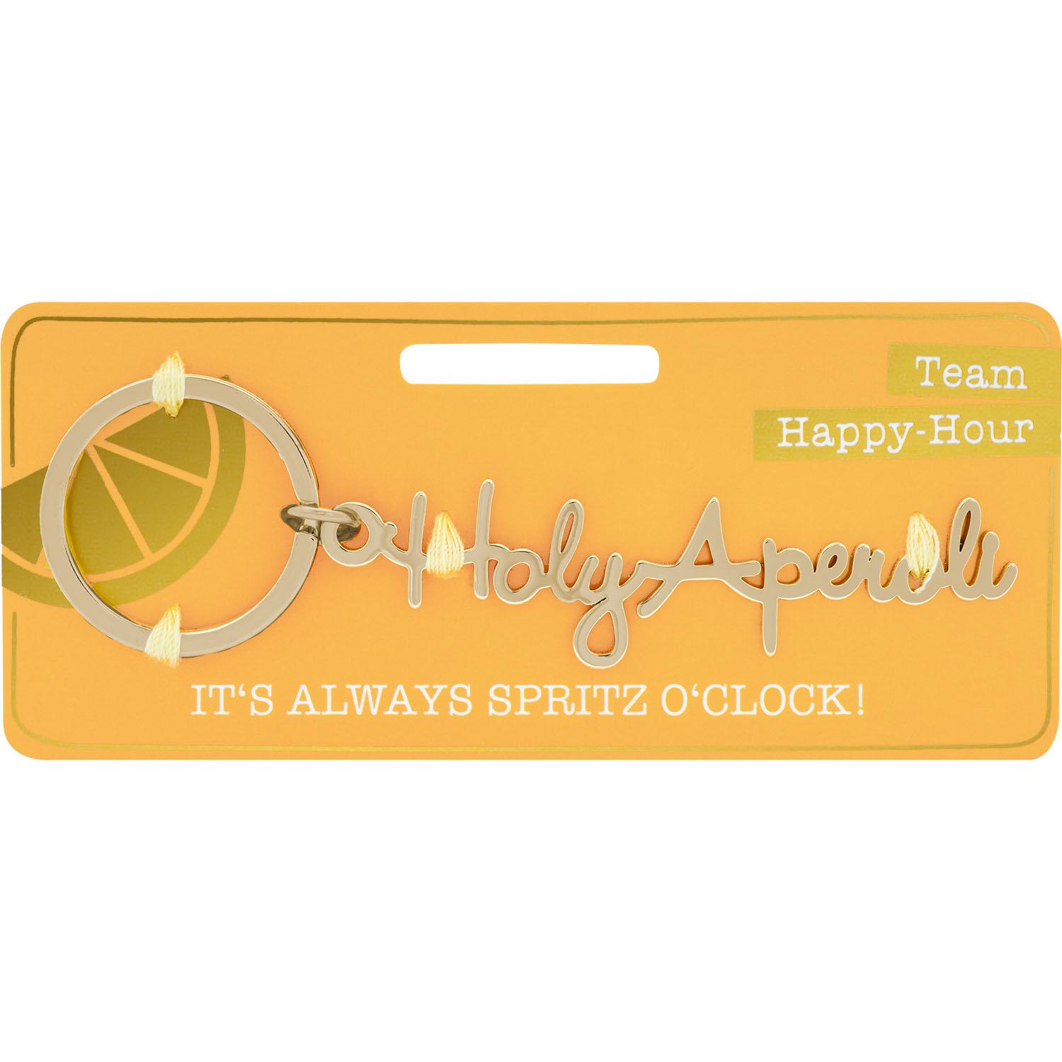 Goldfarbener Schlüsselanhänger mit Schriftzug 'Holy Aperoli' auf orangener Headercard-Verpackung