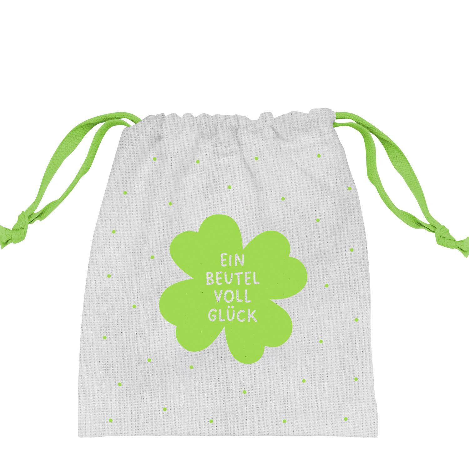 Weiße Canvas-Tasche mit lime-grüner Kleeblatt-Grafik und Schriftzug 'EIN BEUTEL VOLL GLÜCK' mit Zugband