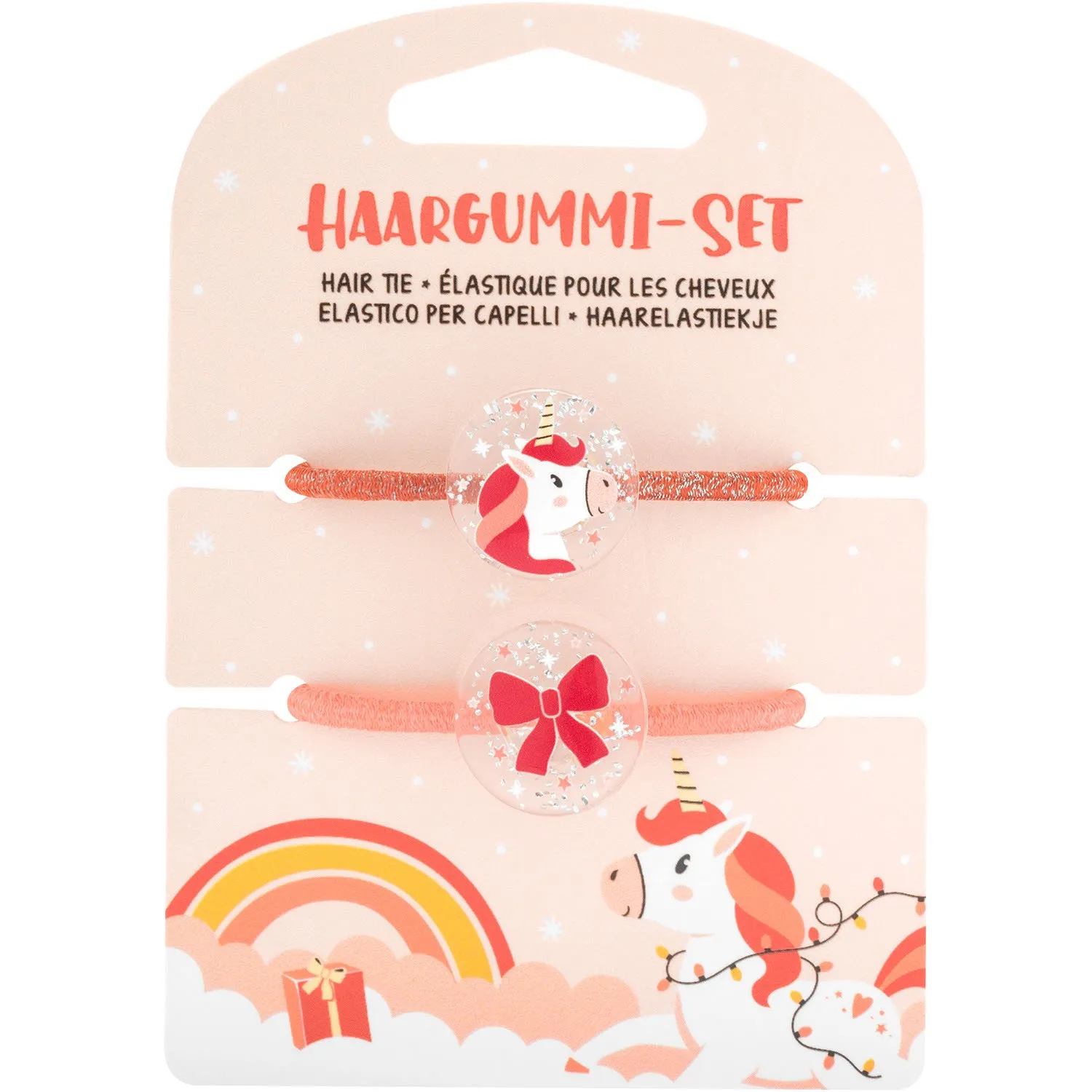 Zwei glitzernde Haargummis auf pastellpinkem Card mit Einhorn-Motiv