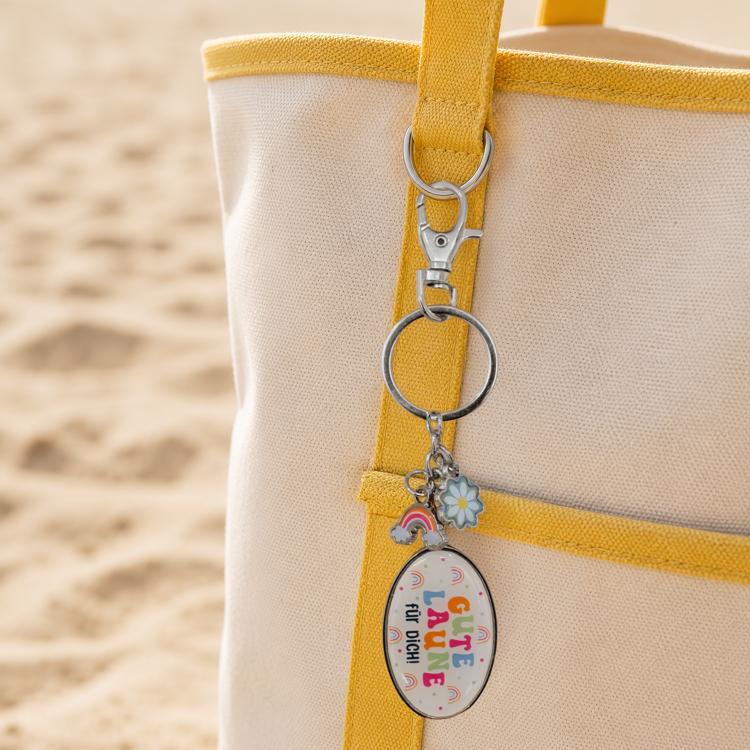 Taschenanhänger »Gute Laune für Dich!« mit bunten Charms aus Metall und Epoxidharz an gelbem Band