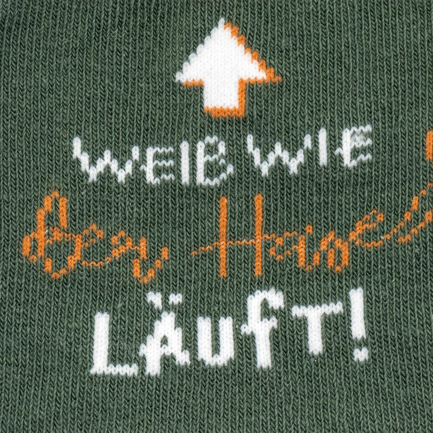 Grüne Zaubersocken mit Hasenmotiv und Spruch 'Weiß wie der Hase läuft!'