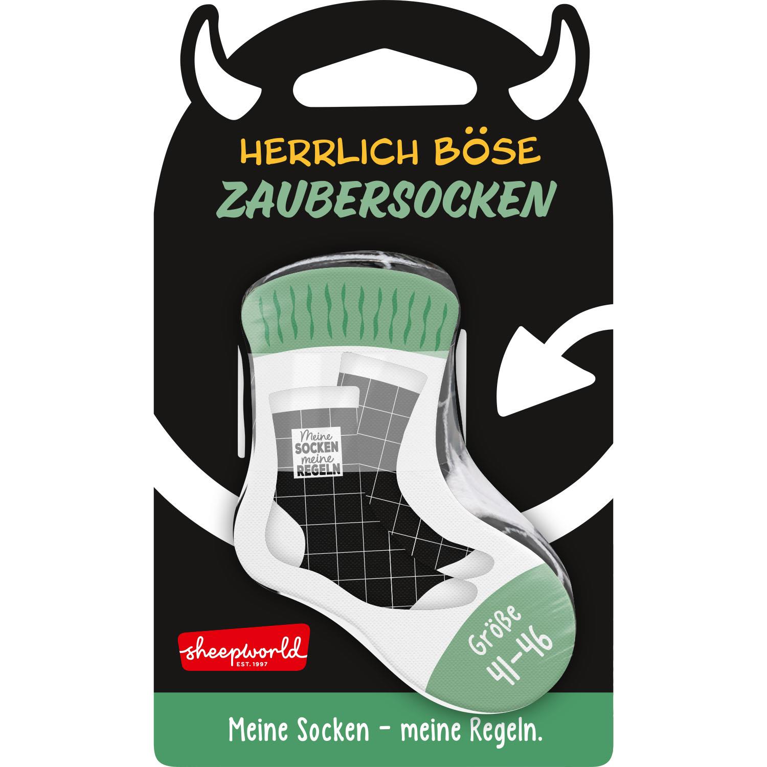 Zaubersocken in schwarzer Verpackung mit grüner Oberseite der Socke und Spruch 'Meine Socken – meine Regeln'.