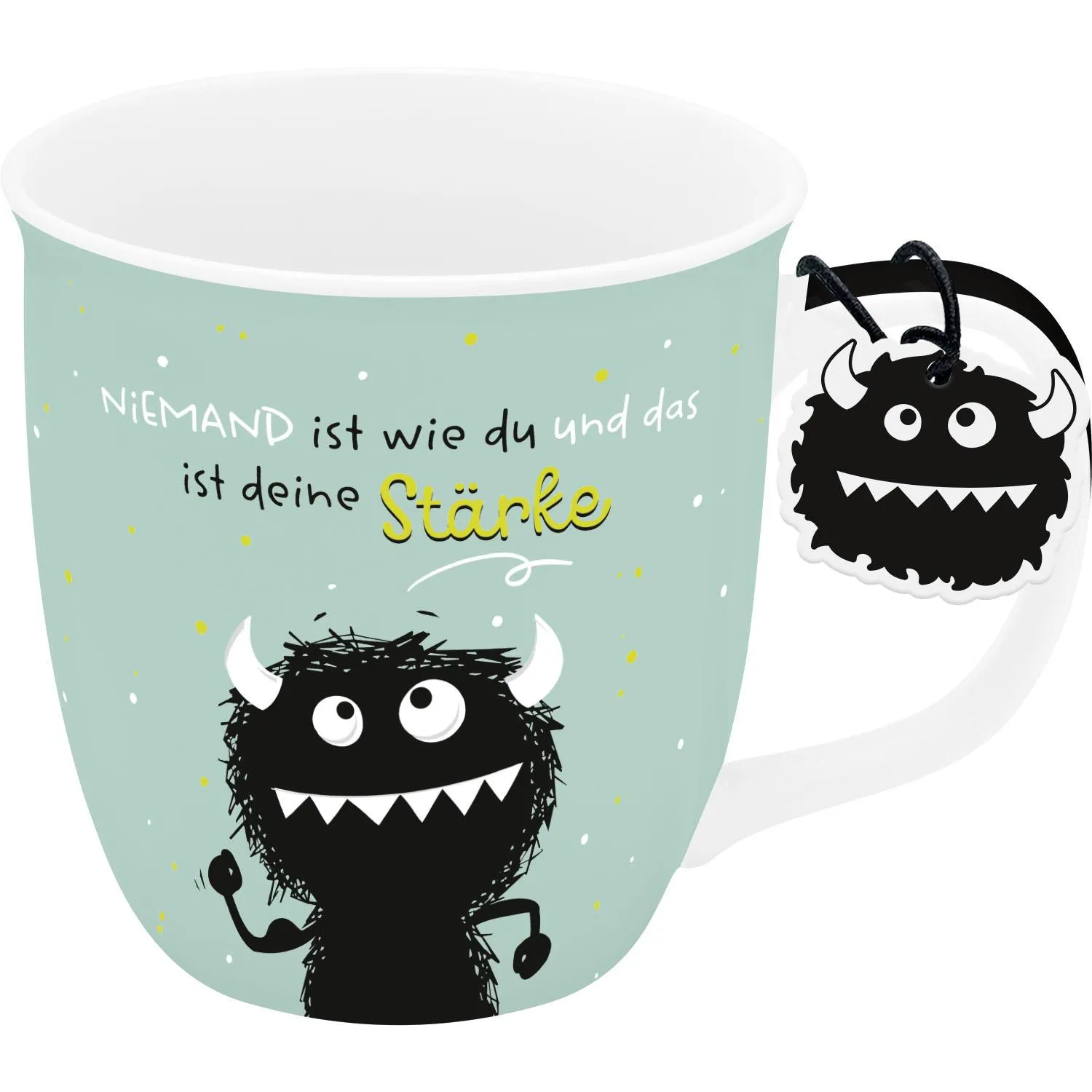Mintgrüne Tasse mit schwarzem Monster-Motiv und gelbem Spruch 'Niemand ist wie du und das ist deine Stärke'.