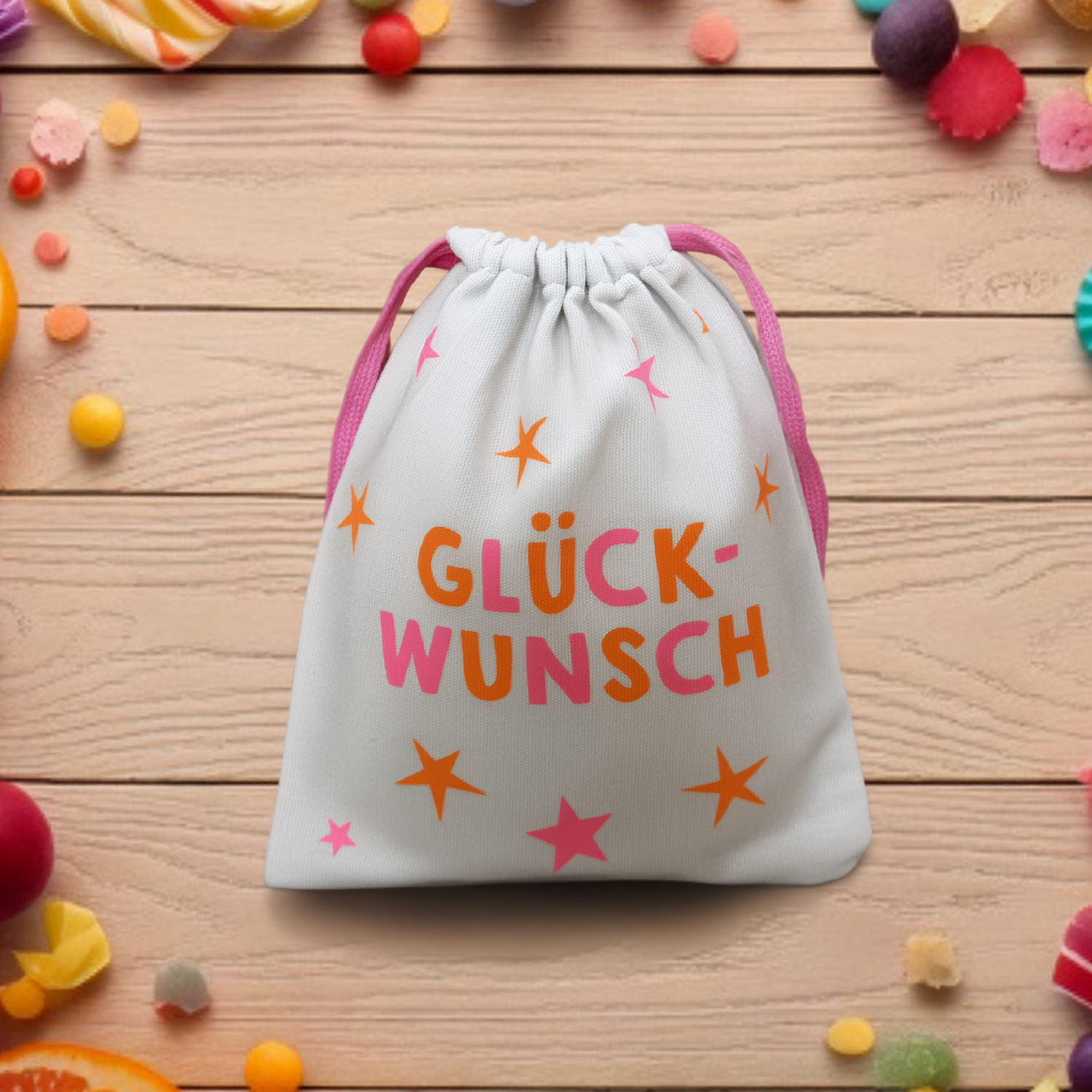 Weißes Canvas-Säckchen mit GLÜCK-WUNSCH-Motiv in Pink/Orange.