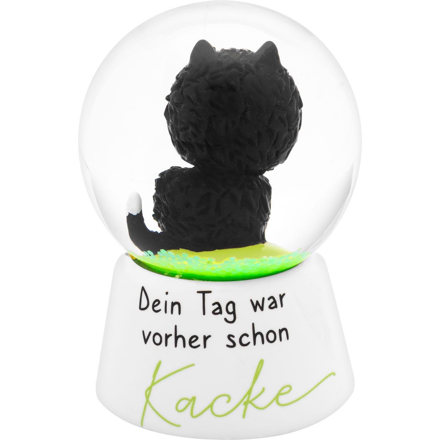 Schwarze Katzen-Schneekugel aus Glas mit grünem Glitzer auf weißem Sockel.