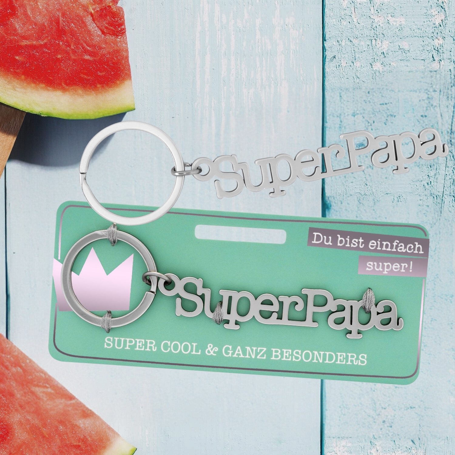 Edelstahl-Schlüsselanhänger 'SuperPapa' mit silbernem Finish auf mintgrüner Karte