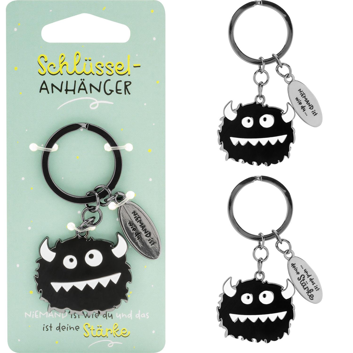 Schlüsselanhänger mit schwarzem Monster-Motiv, silbernem Ring und Textanhänger